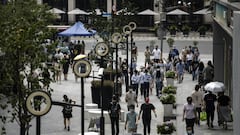 Pedestrians walk along a road in Shanghai, China, on Wednesday, June 29, 2022. Shanghais leader declared victory in defending the financial hub against Covid-19, describing a two-month lockdown that confined millions of people to their homes and spurred sporadic unrest as "completely correct." Photographer: Qilai Shen/Bloomberg via Getty Images