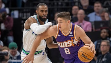 Apr 20, 2024; Minneapolis, Minnesota, USA; Phoenix Suns guard Grayson Allen (8) drives to the basket as Minnesota Timberwolves guard Mike Conley (10) plays defense in the second half during game one of the first round for the 2024 NBA playoffs at Target Center. Mandatory Credit: Jesse Johnson-USA TODAY Sports