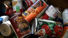 SAN MATEO, CA - NOVEMBER 29:  Donated canned foods sit in a bin at San Mateo High School on November 29, 2017 in San Mateo, California. San Mateo High School students are counting thousands of cans of food and donated packaged food items for their annual 