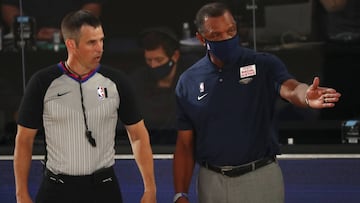 New Orleans Pelicans head coach Alvin Gentry, right, talks with an official during the first half of an NBA basketball game against the Orlando Magic, Thursday, Aug. 13, 2020, in Lake Buena Vista, Fla. (Kim Klement/Pool Photo via AP)