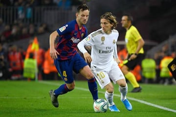 Still class | Barcelona's Croatian midfielder Ivan Rakitic tries to get the ball off his compatriot Luka Modric during El Clasico.