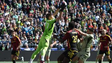 Mar 18, 2023; Seattle, Washington, USA; Los Angeles FC goalkeeper John McCarthy (77) makes a save during the first half against the Seattle Sounders FC at Lumen Field. Mandatory Credit: Kirby Lee-USA TODAY Sports