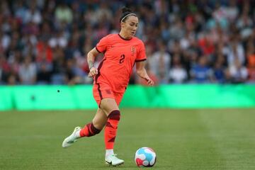Lucy Bronze runs with the ball during England's friendly against the Netherlands on 24 June.