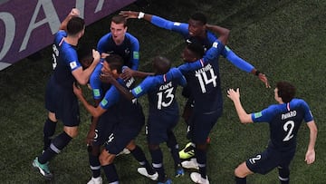 France's defender Samuel Umtiti celebrates with teammates after scoring a goal during the Russia 2018 World Cup semi-final football match between France and Belgium at the Saint Petersburg Stadium in Saint Petersburg on July 10, 2018. / AFP PHOTO / J