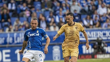 Manu Molina con Cazorla. Duro final para el malaguista,