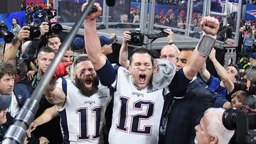 ATLANTA, GA - FEBRUARY 03: Julian Edelman #11 of the New England Patriots and teammate Tom Brady #12 celebrate at the end of the Super Bowl LIII at Mercedes-Benz Stadium on February 3, 2019 in Atlanta, Georgia. The New England Patriots defeat the Los Ange