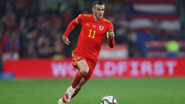 Wales&#039; midfielder Gareth Bale runs with the ball during the FIFA World Cup 2022 play-off semi-final qualifier football match between Wales and Austria at Cardiff City Stadium in Cardiff, south Wales on March 24, 2022. (Photo by Geoff Caddick / AFP)