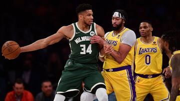 Feb 8, 2022; Los Angeles, California, USA; Milwaukee Bucks forward Giannis Antetokounmpo (34) moves the ball against Los Angeles Lakers forward Anthony Davis (3) and guard Russell Westbrook (0) during the first half at Crypto.com Arena. Mandatory Credit: Gary A. Vasquez-USA TODAY Sports