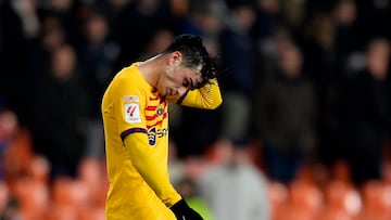 Soccer Football - LaLiga - Valencia v FC Barcelona - Mestalla, Valencia, Spain - December 16, 2023 FC Barcelona's Pedri looks dejected after the match REUTERS/Pablo Morano