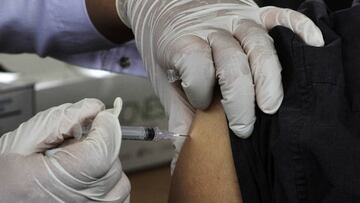 JAKARTA, INDONESIA - JANUARY 25: A health officer injects a second COVID-19 vaccine booster to a resident at the courtyard of the Jakarta Governor's office in Jakarta, Indonesia on January 25, 2023. Indonesian Ministry of Health is set to start administering the second COVID-19 vaccine booster for the public on Tuesday, January 24, 2023, as an effort to accelerate vaccination while increasing protection against the virus. (Photo by Eko Siswono Toyudho/Anadolu Agency via Getty Images)