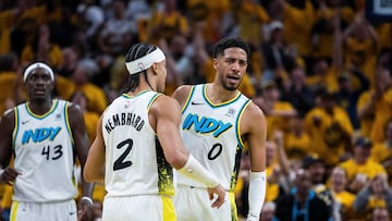 Indiana Pacers guard Andrew Nembhard (2) and guard Tyrese Haliburton (0) celebrate in the first half against the Milwaukee Bucks at Gainbridge Fieldhouse.
