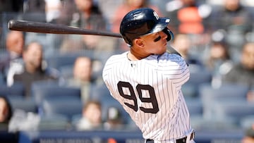 BRONX, NEW YORK - MARCH 30: Aaron Judge #99 of the New York Yankees hits a solo home run during the first inning against the San Francisco Giants on Opening Day at Yankee Stadium on March 30, 2023 in the Bronx borough of New York City.   Sarah Stier/Getty Images/AFP (Photo by Sarah Stier / GETTY IMAGES NORTH AMERICA / Getty Images via AFP)
