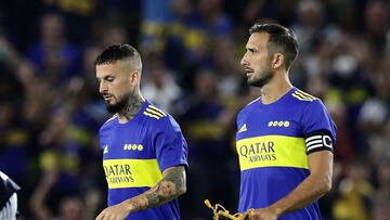 Boca Juniors' forward Dario Benedetto (L) and defender Carlos Izquierdoz enter the field before an Argentine Professional Football League match against Colon at La Bombonera stadium in Buenos Aires, on February 13, 2022. (Photo by ALEJANDRO PAGNI / AFP)
