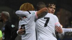 Paris Saint-Germain&#039;s French forward Kylian Mbappe (C) celebrates with Paris Saint-Germain&#039;s Dutch midfielder Xavi Simons (L) and Paris Saint-Germain&#039;s French defender Edouard Michut (R) after scoring a goal during the French Cup round of 16 football match between Vannes OC and Paris Saint-Germain (PSG) at La Rabine Stadium in Vannes, western France, on January 3, 2022. (Photo by Sebastien SALOM-GOMIS / AFP)