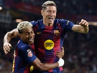 Barcelona's Polish forward #09 Robert Lewandowski (R) celebrates with Barcelona's Spanish forward #10 Lamine Yamal scoring his team's second goal during the Spanish league football match between FC Barcelona and Real Sociedad at the Estadi Olimpic Lluis Companys in Barcelona on September 28, 2025. (Photo by Josep LAGO / AFP)