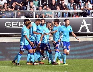 Olympique de Marseille's players jubilant after scoring against Amiens.