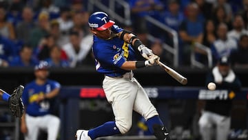 Venezuela's infielder #77 Wilfredo Jose Tovar bats during the Caribbean Series baseball game between Nicaragua and Venezuela at LoanDepot Park in Miami, Florida, on February 7, 2024. (Photo by Chandan Khanna / AFP)