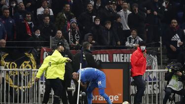 Olympique de Marseille's Dimitri Payet is hit by a water bottle thrown by a fan.