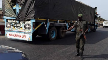 A Rapid Respond Squad officer mans a checkpoint in Lagos. 