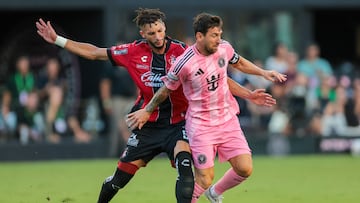 Jul 30, 2025; Ft. Lauderdale, Florida, USA; Inter Miami CF forward Lionel Messi (10) dribbles the ball past Atlas FC defender Doria (5) during the first half of a group stage League Cup match at Chase Stadium. Mandatory Credit: Sam Navarro-Imagn Images