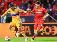 Angel Correa (L) of Tigres fights for the ball with Franco Romero (R) of Toluca during the 3rd round match between Toluca and Tigres UANL as part of the Liga BBVA MX, Torneo Apertura 2025 at Nemesio Diez Stadium, on July 26, 2025 in Toluca, Estadio de Mexico, Mexico.