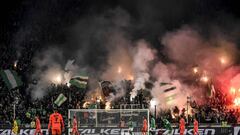 (FILES) In this file photo taken on December 15, 2019 Supporters light flares and wave flags during the French L1 football match between AS Saint-Etienne (ASSE) and Paris Saint-Germain (PSG) at the Geoffroy Guichard Stadium in Saint-Etienne, central Franc