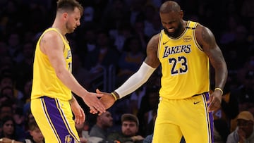 Feb 27, 2025; Los Angeles, California, USA; Los Angeles Lakers guard Luka Doncic (77) and forward LeBron James (23) celebrate after a play during the fourth quarter against the Minnesota Timberwolves at Crypto.com Arena. Mandatory Credit: Jason Parkhurst-Imagn Images