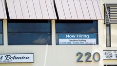 A staffing agency displays a &quot;Now Hiring&quot; sign in Tampa, Florida, U.S., June 1, 2021. 