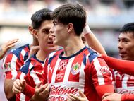 Guadalajara's forward #34 Armando Gonzalez (C) celebrates with teammates after scoring during the Liga MX Apertura football match between Guadalajara and Monterrey at the Akron Stadium in Zapopan, Mexico on November 8, 2025. (Photo by Ulises Ruiz / AFP)