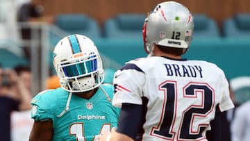 Jan 1, 2017; Miami Gardens, FL, USA; Miami Dolphins wide receiver Jarvis Landry (14) greets New England Patriots quarterback Tom Brady (12) before their game at Hard Rock Stadium. Mandatory Credit: Steve Mitchell-USA TODAY Sports