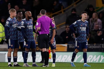 Martinelli makes his way back to the changing room after a double booking.