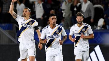 Apr 13, 2019; Carson, CA, USA; Los Angeles Galaxy forward Zlatan Ibrahimovic (9), defender Diego Polenta (3) and defender Jorgen Skjelvik (16) celebrate after scoring a  goal in the first half of the game at StubHub Center.   Mandatory Credit: Jayne Kamin