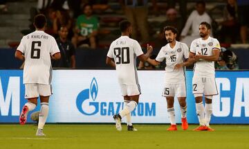 Soccer Football - FIFA Club World Cup Third Place Match - Al Jazira vs CF Pachuca - Zayed Sports City Stadium, Abu Dhabi, United Arab Emirates - December 16, 2017   Al Jazira’s Khalfan Alrezzi celebrates with Salem Ali Ibrahim and Salem Rashid after scoring their first goal    REUTERS/Matthew Childs