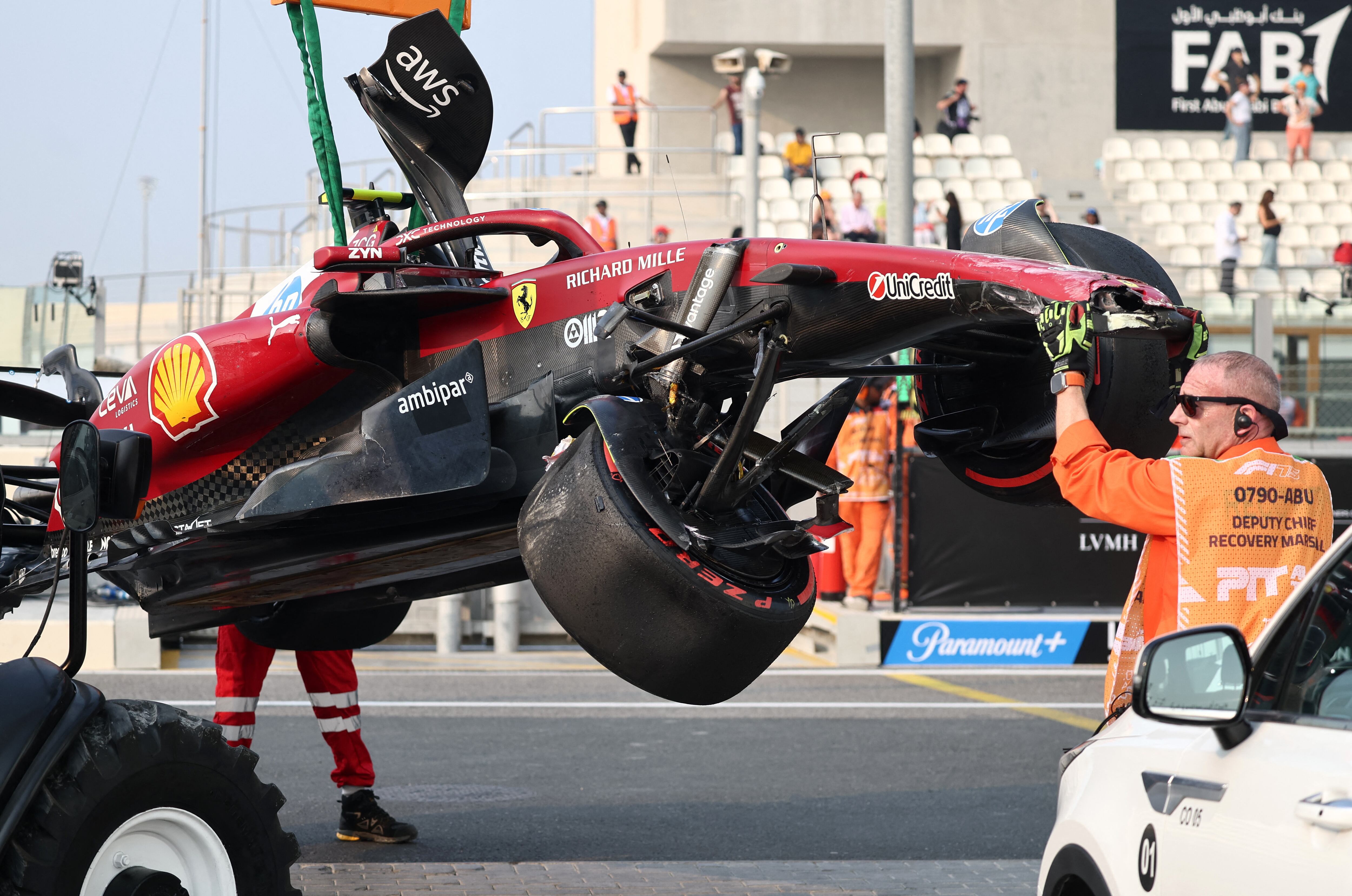 Formula One F1 - Abu Dhabi Grand Prix - Yas Marina Circuit, Abu Dhabi, United Arab Emirates - December 6, 2025 Stewards retrieve the car of Ferrari's Lewis Hamilton after he crashes out during practice REUTERS/Jakub Porzycki