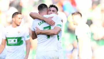 ELCHE, SPAIN - JANUARY 16: Guido Carrillo embraces Lucas Boye of Elche after their sides victory during the LaLiga Santander match between Elche CF and Villarreal CF at Estadio Manuel Martinez Valero on January 16, 2022 in Elche, Spain. (Photo by Aitor Al