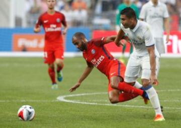 Casemiro (right) tussles with PSG's Lucas Moura.