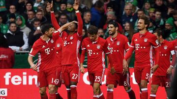 Bayern Munich's Austrian midfielder David Alaba and his teammates celebrate after scoring during the German first division Bundesliga football match of Werder Bremen vs FC Bayern Munich in Bremen , nothern Germany, on January 28, 2017. / AFP PHOTO / PATRIK STOLLARZ / RESTRICTIONS: DURING MATCH TIME: DFL RULES TO LIMIT THE ONLINE USAGE TO 15 PICTURES PER MATCH AND FORBID IMAGE SEQUENCES TO SIMULATE VIDEO. == RESTRICTED TO EDITORIAL USE == FOR FURTHER QUERIES PLEASE CONTACT DFL DIRECTLY AT + 49 69 650050