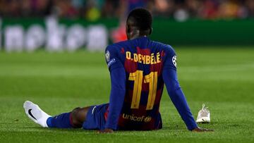 Barcelona&#039;s French forward Ousmane Dembele sits on the ground after an injury during the UEFA Champions League Group F football match between FC Barcelona and Borussia Dortmund at the Camp Nou stadium in Barcelona, on November 27, 2019. (Photo by Jos