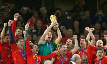 Casillas (centre) lifts the World Cup for Spain - having overcome "really difficult opponents" Paraguay in the quarter-finals.