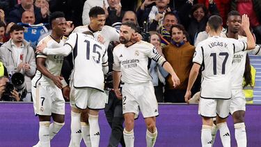 Real Madrid's English midfielder #5 Jude Bellingham (C) celebrates scoring his team's second goal with teammates during the Spanish league football match between Real Madrid CF and Girona FC at the Santiago Bernabeu stadium in Madrid on February 10, 2024. (Photo by OSCAR DEL POZO / AFP)