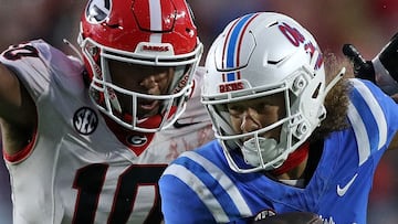 OXFORD, MISSISSIPPI - NOVEMBER 09: Cayden Lee #19 of the Mississippi Rebels carries the ball against Damon Wilson II #10 of the Georgia Bulldogs during the second half at Vaught-Hemingway Stadium on November 09, 2024 in Oxford, Mississippi. Ole Miss defeated Georgia 28-10. Justin Ford/Getty Images/AFP (Photo by Justin Ford / GETTY IMAGES NORTH AMERICA / Getty Images via AFP)