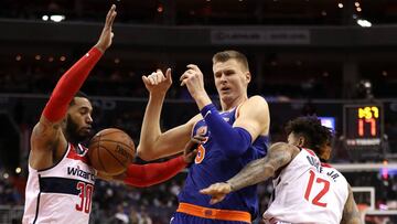 WASHINGTON, DC - JANUARY 03: Kristaps Porzingis #6 of the New York Knicks loses control of the ball in front of Mike Scott #30 and Kelly Oubre Jr. #12 of the Washington Wizards during the first half at Capital One Arena on January 3, 2018 in Washington, DC. NOTE TO USER: User expressly acknowledges and agrees that, by downloading and or using this photograph, User is consenting to the terms and conditions of the Getty Images License Agreement.   Patrick Smith/Getty Images/AFP
 == FOR NEWSPAPERS, INTERNET, TELCOS &amp; TELEVISION USE ONLY ==