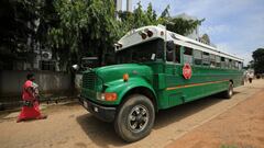 A woman walks near to a bus parked on a street, as government struggles to contain the spread of the coronavirus disease (COVID-19) in Abuja, Nigeria June 18, 2020. REUTERS/Afolabi Sotunde