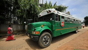 A woman walks near to a bus parked on a street, as government struggles to contain the spread of the coronavirus disease (COVID-19) in Abuja, Nigeria June 18, 2020. REUTERS/Afolabi Sotunde