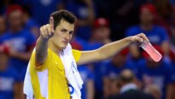 Tomic celebra la victoria ante Evans