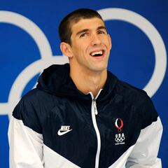 When did Michael Phelps retire? How many Olympic medals did he win?