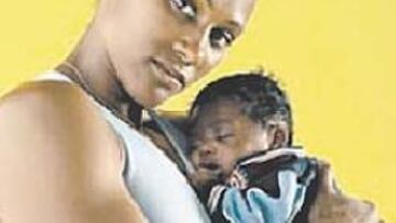 <b>MARION Y TIMMY.</b> La campeona olímpica, con su hijo.