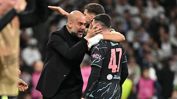 Manchester City's English midfielder #47 Phil Foden celebrates with Manchester City's Spanish manager Pep Guardiola and Manchester City's Portuguese defender #03 Ruben Dias scoring his team's second goal during the UEFA Champions League quarter final first leg football match between Real Madrid CF and Manchester City at the Santiago Bernabeu stadium in Madrid on April 9, 2024. (Photo by JAVIER SORIANO / AFP)