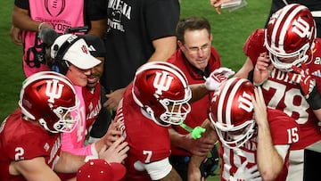 Jan 19, 2026; Miami Gardens, FL, USA; Indiana Hoosiers quarterback Fernando Mendoza (15) celebrates with head coach Curt Cignetti after scoring a touchdown against the Miami Hurricanes in the fourth quarter during the College Football Playoff National Championship game at Hard Rock Stadium. Mandatory Credit: Kim Klement Neitzel-Imagn Images