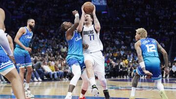 Mar 19, 2022; Charlotte, North Carolina, USA; Dallas Mavericks guard Luka Doncic (77) drives against Charlotte Hornets guard Terry Rozier (3) during the first half at Spectrum Center. Mandatory Credit: Brian Westerholt-USA TODAY Sports